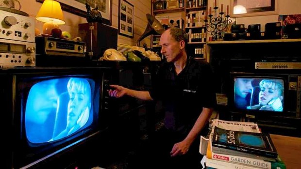 Off the air: John Hunter with some of his collection of analog televisions. From December 3 transmissions will be digital only.