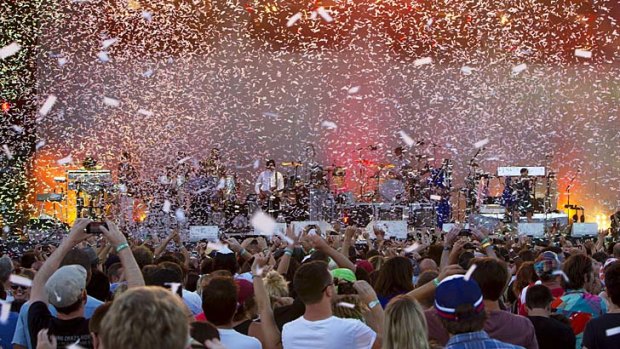 Confetti covers the crowd as Arcade Fire play their final song at the Big Day Out in Sydney.