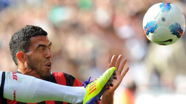 Booted ... Carlos Tevez could move to AC Milan over French club Paris Saint-Germain or Italian giant Juventus.