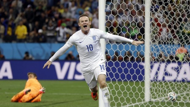 Relief ... England's Wayne Rooney celebrates after scoring his side's first goal during the Group D against Uruguay.