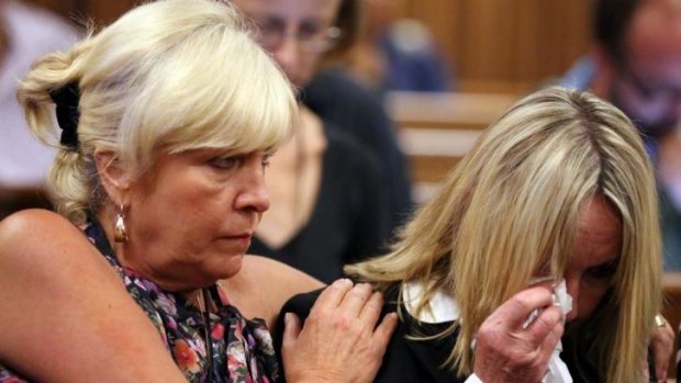 Raw emotion ... June Steenkamp (right), mother of Reeva Steenkamp, is comforted by her friend Jenny Strydom as footage is shown during Oscar Pistorius' murder trial.