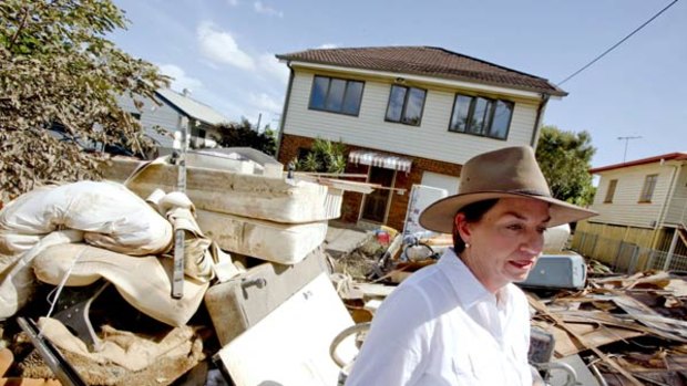 Queensland Premier Anna Bligh tours the devastated Brisbane suburb of Rocklea yesterday.