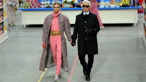 Karl Lagerfeld and with model Cara Delevingne closed the Chanel show (in sneakers) at Paris Fashion Week in March.