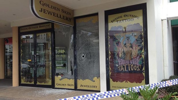 Bullet holes at the front of a Mooloolaba store. Photo: Iain Curry, Sunshine Coast Daily
