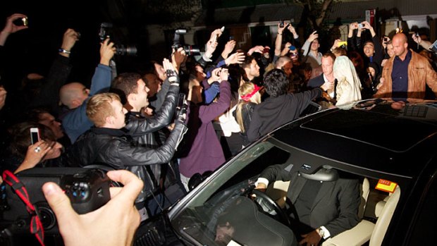The Fame Monster ... Lady Gaga is mobbed by hundreds of fans and photographers outside Nevermind nightclub.