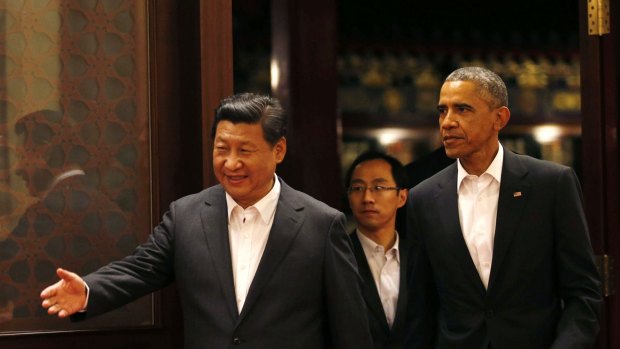 Polite host: China's President Xi Jinping and US President Barack Obama at the Asia Pacific Economic Co-operation summit in Beijing.
