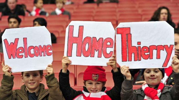 Young Arsenal fans show their support for ex-Arsenal legend Thierry Henry.