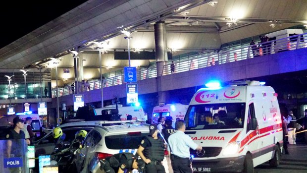 Turkish security officers and ambulances gather outside Istanbul Ataturk Airport.
