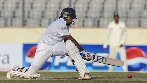 Sri Lanka's Mahela Jayawardene attempts a reverse sweep during his innings of 203 not out.