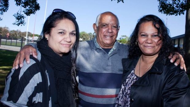 Tracey Robinson mother of Nathan Merritt, Chistine Robinson, mother of Reece Robinson, with their father Eric Robinson at Redfern Oval on Friday.