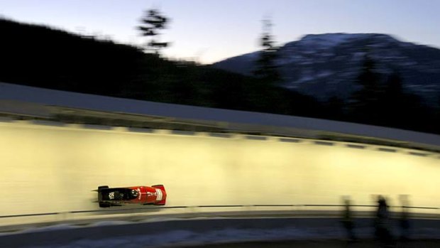 A bobsleigh hurtles around the track.