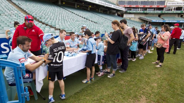 Good signs: Alessandro Del Piero and his Sydney FC teammates sign autographs at Allianz Stadium.