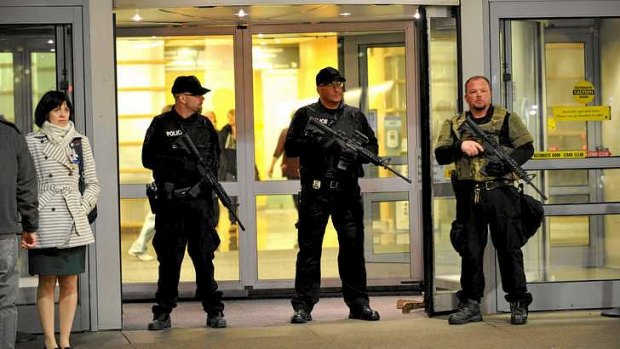 Armed police officers secure the main entrance to Brigham and Women's Hospital in Boston.