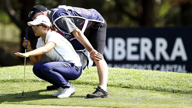 School's in ... New Zealander Lydia Ko lines up a putt during her astonishing first round.