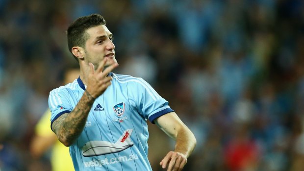 Getting the ball rolling: Corey Gameiro responds to the crowd after scoring Sydney FC's first goal of the night.