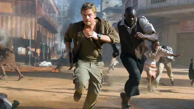 Leonardo DiCaprio and Djimon Hounsou flee through Freetown in <i>Blood Diamond</i>.