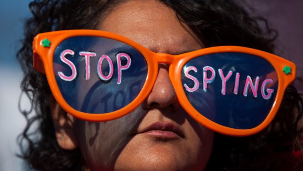 A woman attends the Stop Watching Us rally in Washington, DC.