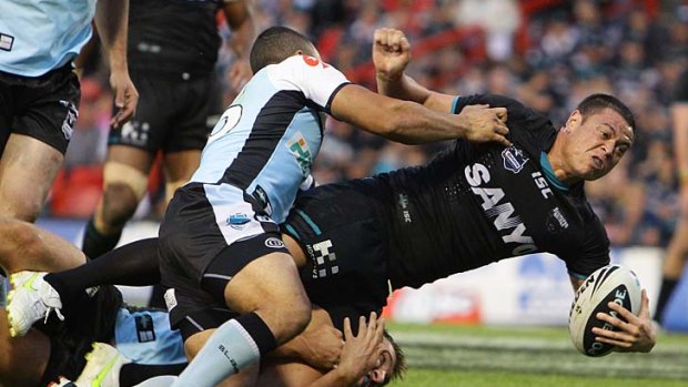 Timana Tahu of the Panthers is tackled.