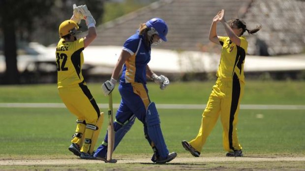Rhiannon Dick is dismissed to the delight of Fury players, Jenny Wallace and Gemma Triscari.