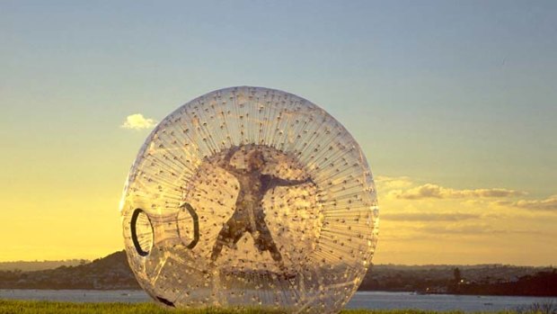 Having a ball ... zorbing by the lake.