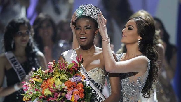 Miss Angola Leila Lopes, left, is crowned Miss Universe 2011 by Miss Universe 2010 Ximena Navarrete, of Mexico, in Sao Paulo.
