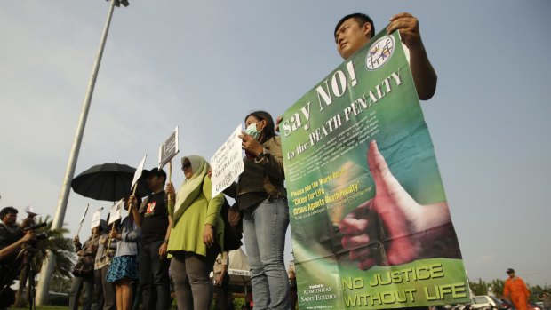 Protesters attend a rally against death penalty outside the presidential palace in Jakarta, Indonesia, on Tuesday.