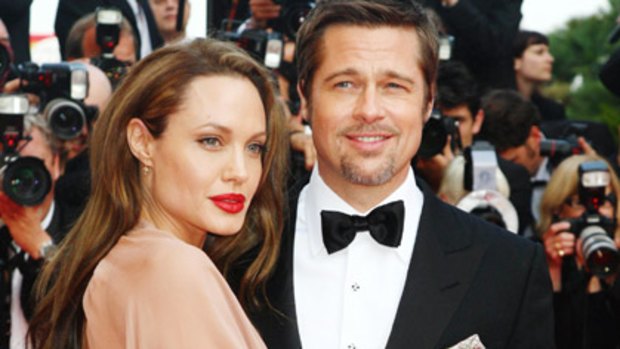 Puckering up: Brad Pitt and Angelina Jolie.