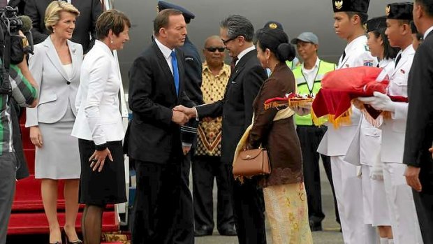 Prime Minister Tony Abbott is greeted by Indonesian Foreign Minister Marty Natalegawa on his arrival in Jakarta for an official visit.