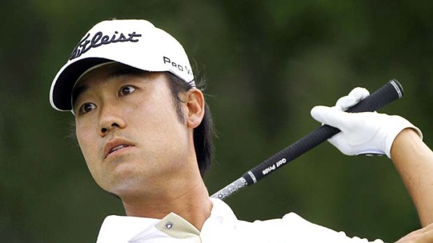 Alarmed . . . Kevin Na watches his second drive off the ninth tee head towards trouble.