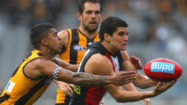Leigh Montagna, under pressure here from Hawk Bradley Hill, says the umpires are paying closer attention to stoppages.