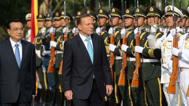 Billion dollar deals loom: Prime Minister Tony Abbott walks with the Premier of the People's Republic of China, Li Keqiang.