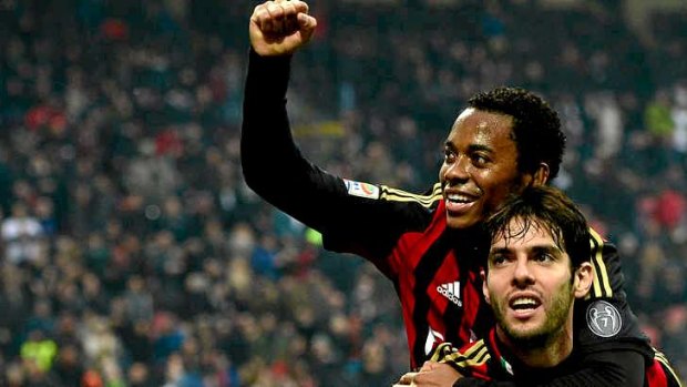 Kaka celebrates after scoring a goal for AC Milan with fellow Brazilian Robinho (top).
