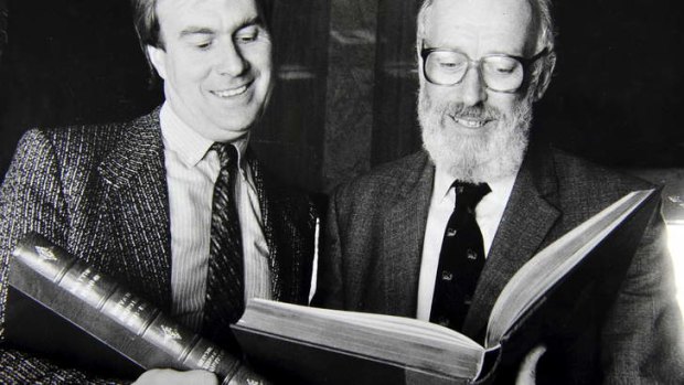 The assistant director of the Natioanl Library Bill Thorne (right) inspects one of the Matthew Flinders books presented to the library by Publisher Brian Roylance (left).