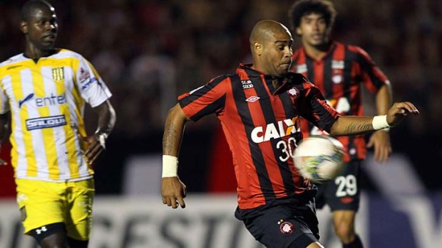 Atletico Paranaense's Adriano controls the ball during a Libertadores Cup match against Bolivian The Strongest at the Vila Capanema stadium in Curitiba, Brazil.