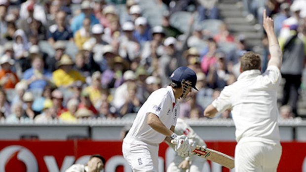 Peter Siddle celebrates as teammate Shane Watson snares Alastair Cook at first slip.