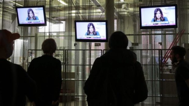 National attention: People watch a live news conference with Pussy Riot after their release from prison.