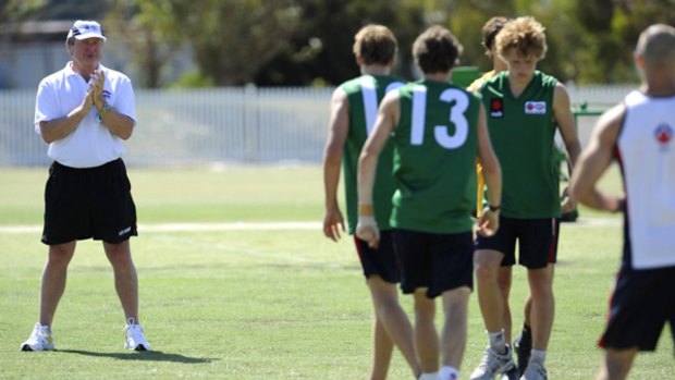 Kevin Sheedy watches AIS-AFL Academy teenagers training in Melbourne yesterday.