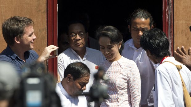 Leader of Myanmar's National League for Democracy party, Aung San Suu Kyi leaves NLD headquarters after delivering a speech to her supporters in Yangon on Monday. 