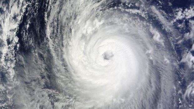 A NASA satellite image shows Typhoon Phanfone in the western Pacific Ocean. 