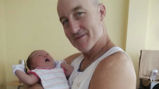 Kevin Lee, the Australian ex-priest who has died in the Philippines during Typhoon Haiyan, with daughter Michelle.