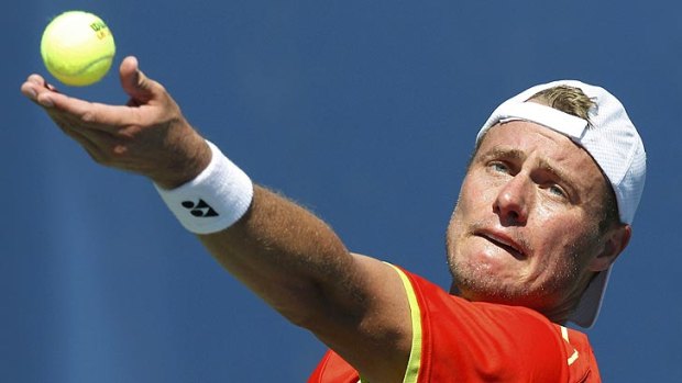 Lleyton Hewitt serves to Tobias Kamke of Germany during their men's singles match at the US Open tennis tournament in New York.