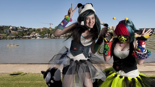 Fifteen-year-olds Bethany Hunter and Jemma Ludke enjoyed the Queensland sunshine at a rave event at New Farm Park on Saturday.