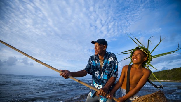 Family fishing in Cook Islands.