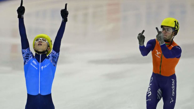 Sore loser: Sjinkie Knegt gestures to Viktor Ahn as he celebrates his win.