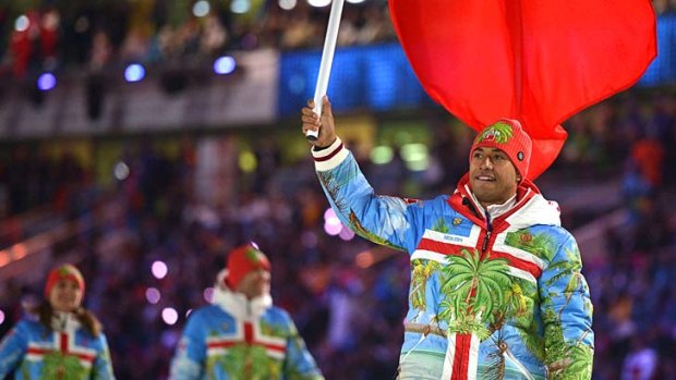 Semi, bearing the Tongan flag at the opening ceremony.