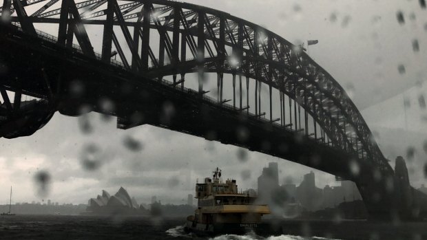 Heavy rain showers Sydney, but the prospects for Mardi Gras look a little brighter.