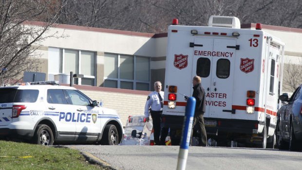 Emergency responders gather in the parking lot of the Franklin Regional High School where 19 students and one adult were stabbed on Wednesday. The suspect, a male student, was taken into custody and being questioned.