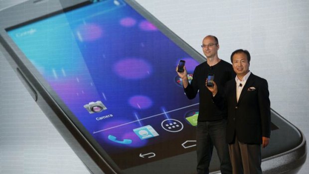 J.K. Shin, right, president and head of mobile communications business from Samsung, and Andy Rubin, senior vice president of Google Mobile, unveil the Galaxy Nexus, the first smartphone to feature Android 4.0 Ice Cream Sandwich and a HD Super AMOLED display.