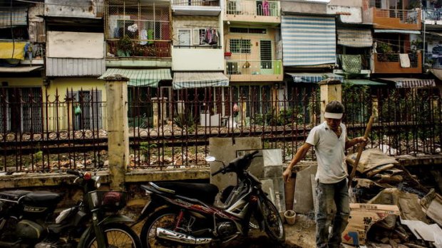 Rising heat: While the motor scooters in this Ho Chi Minh City slum point to economic progress anger is rising at the one-party system.