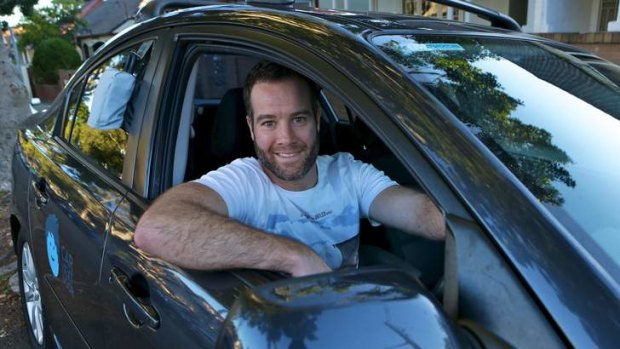Carl O'Sullivan with his Mazda3 that he rents out to strangers as part of  car-sharing scheme Car Next Door.